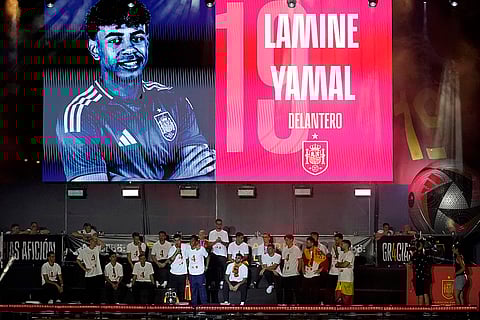 Spain's team captain Alvaro Morata introduces teammate Lamine Yamal